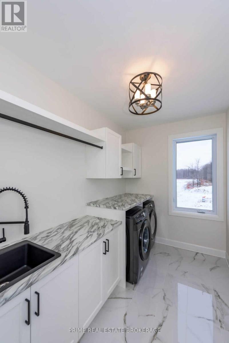 Example of laundry room from model home. - 10142 Pinery Bluffs Road, Lambton Shores, ON - Indoor Photo Showing Kitchen