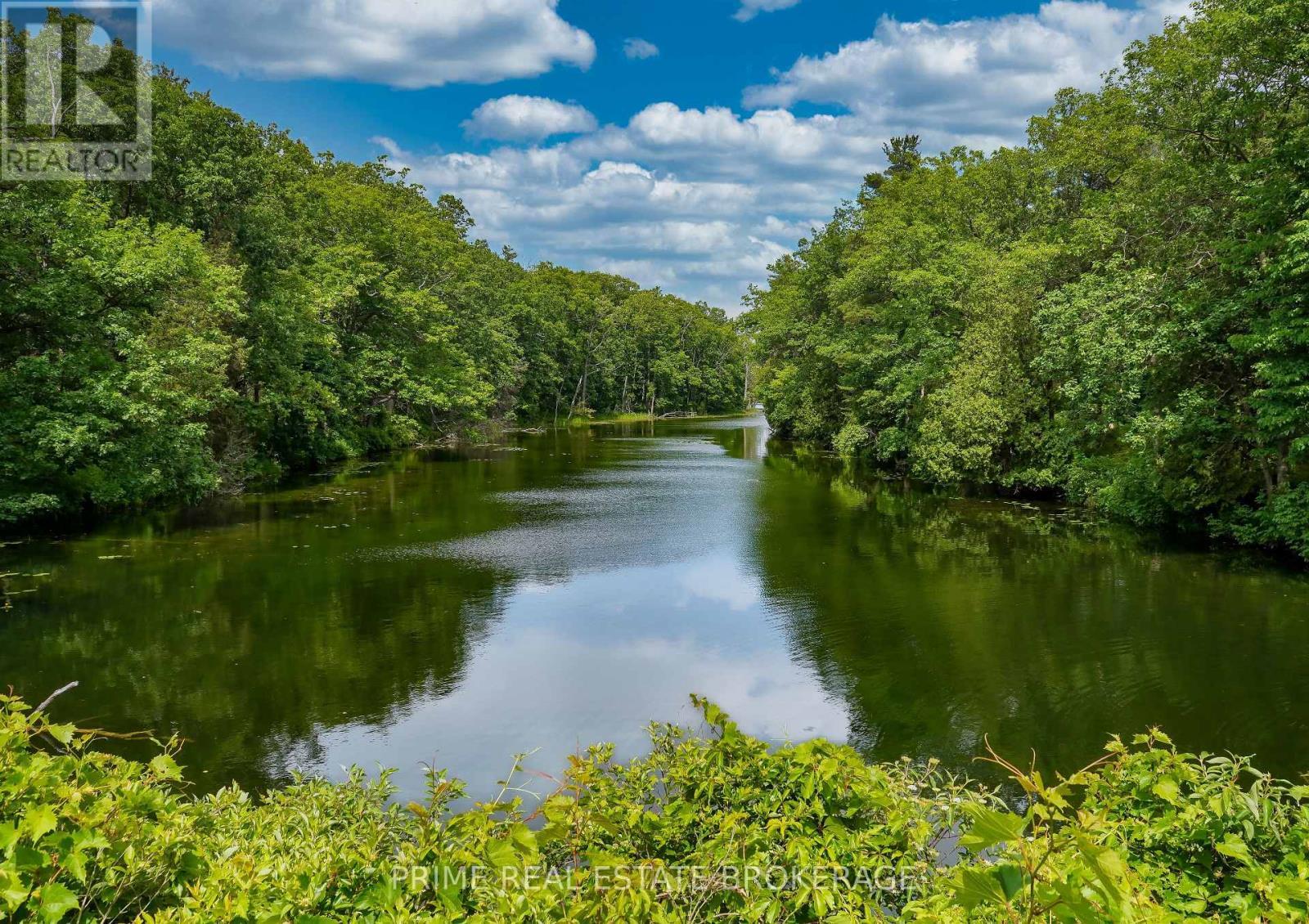 Ausable Channel running through Pinery Park - 10142 Pinery Bluffs Road, Lambton Shores, ON - Outdoor With Body Of Water With View