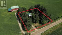 The property is bordered by beautiful mature trees -