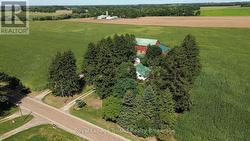 Driveway closest to the house serves the property. -