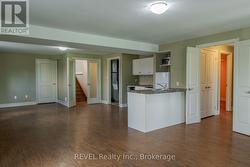Open concept lower kitchen, living, dining -