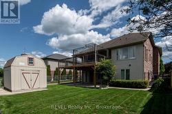 Rear elevation, yard, shed -