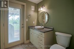 Lower 2 piece bathroom with walkout to backyard -