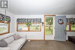 Cozy sunroom with inviting front entrance -