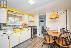 Kitchen with a large window and laundry room -