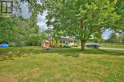 Front view of the house and shed -