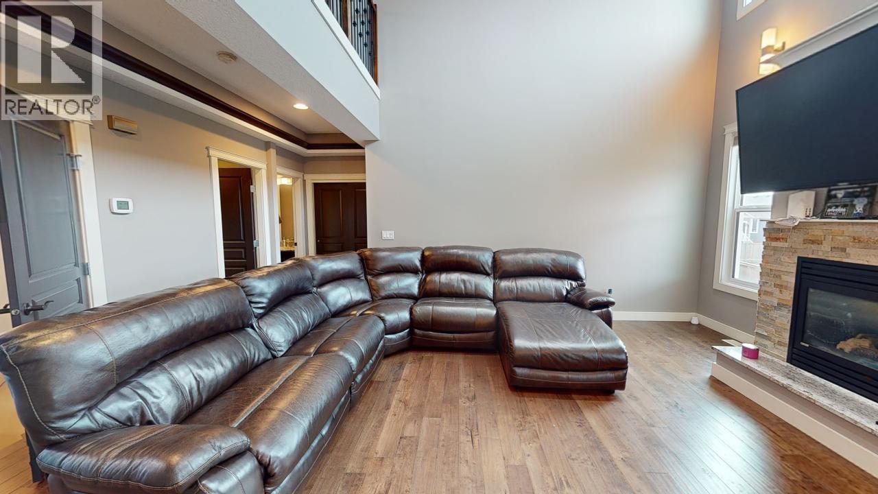10712 109 Street, Fort St. John, BC - Indoor Photo Showing Living Room With Fireplace