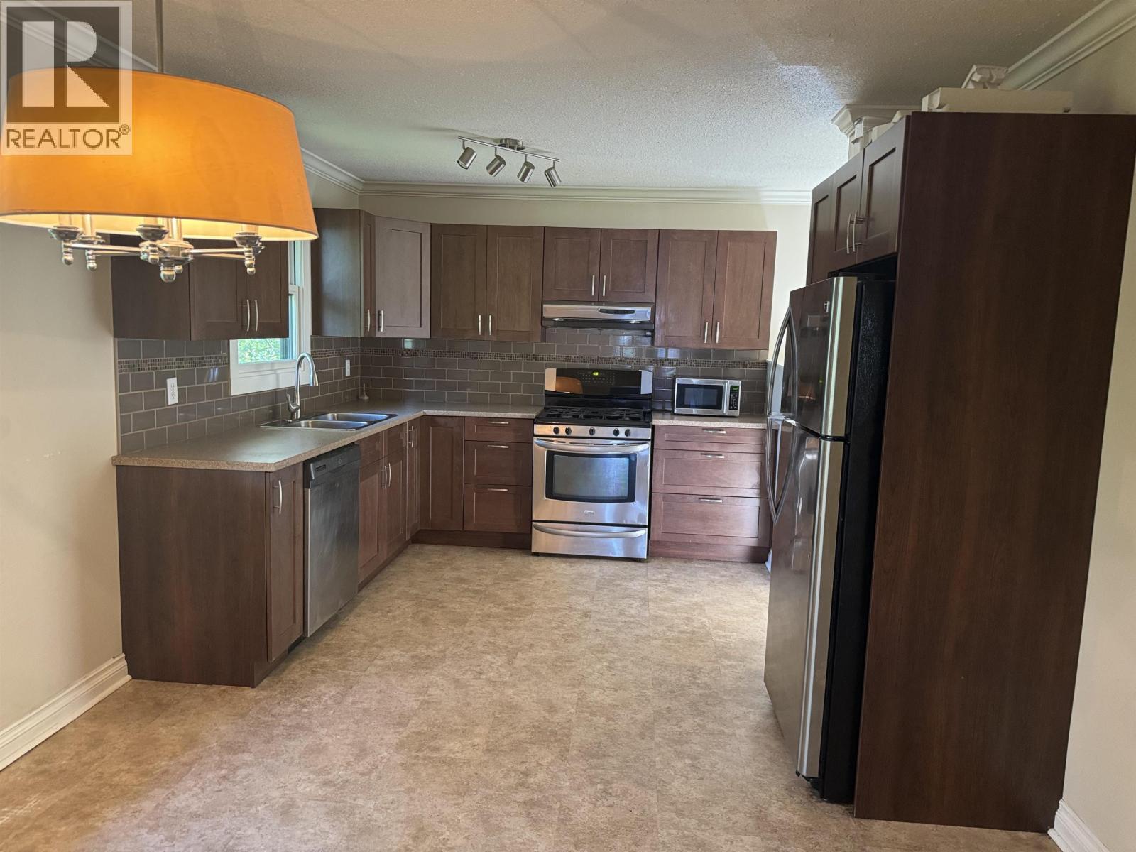 104 Nechako Drive, Mackenzie, BC - Indoor Photo Showing Kitchen With Double Sink