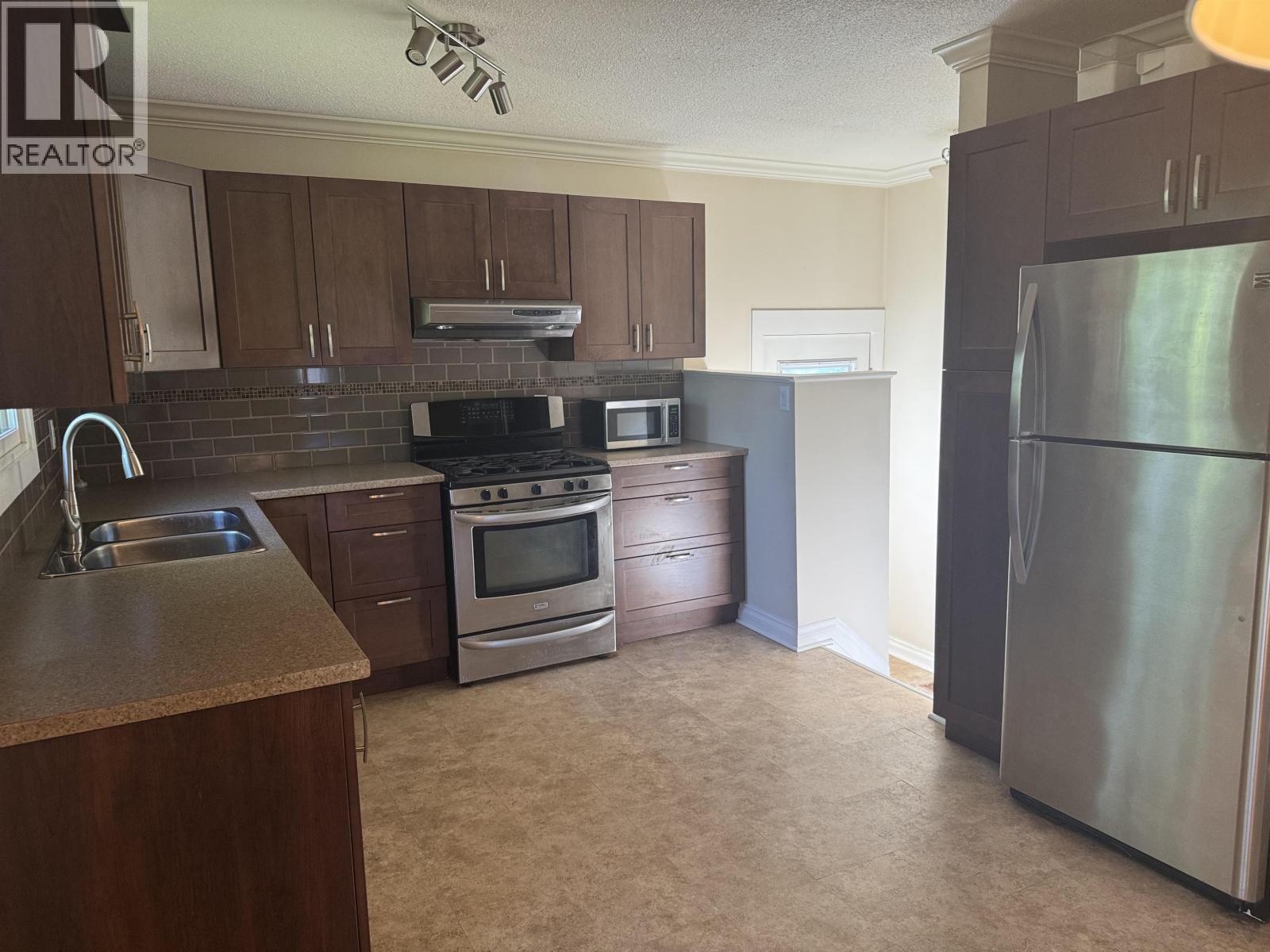 104 Nechako Drive, Mackenzie, BC - Indoor Photo Showing Kitchen With Double Sink