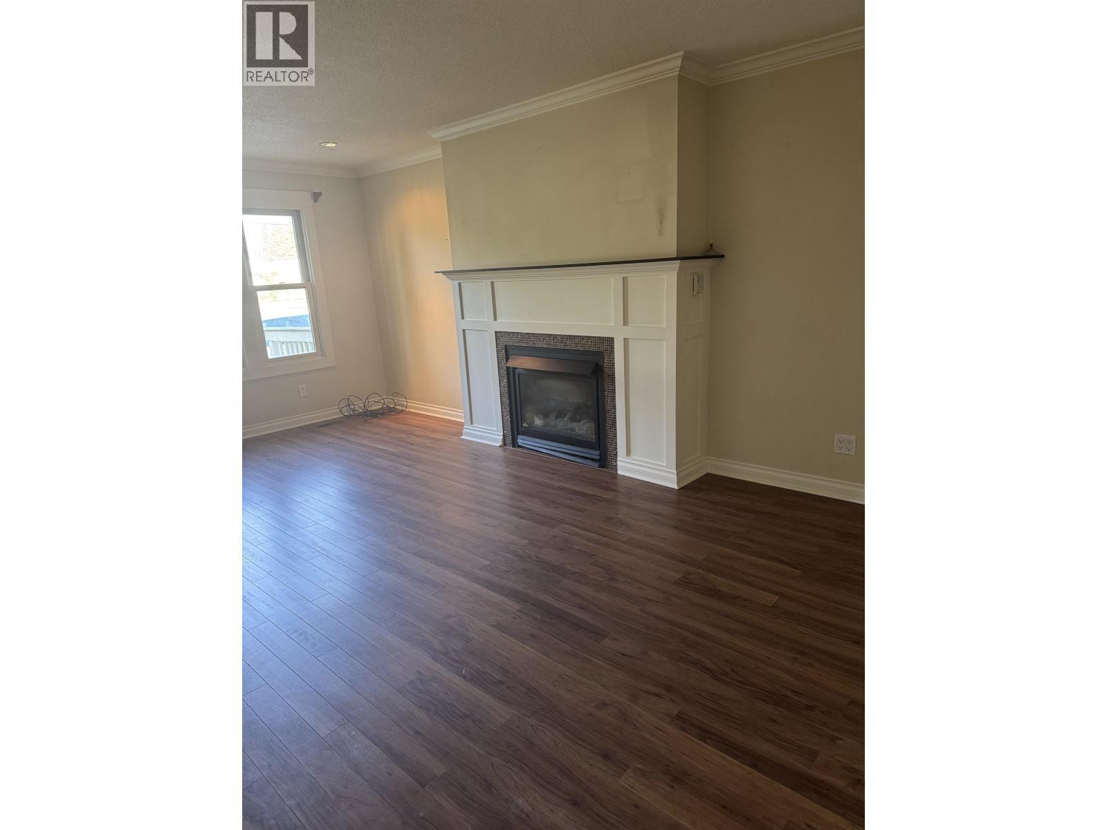 104 Nechako Drive, Mackenzie, BC - Indoor Photo Showing Living Room With Fireplace