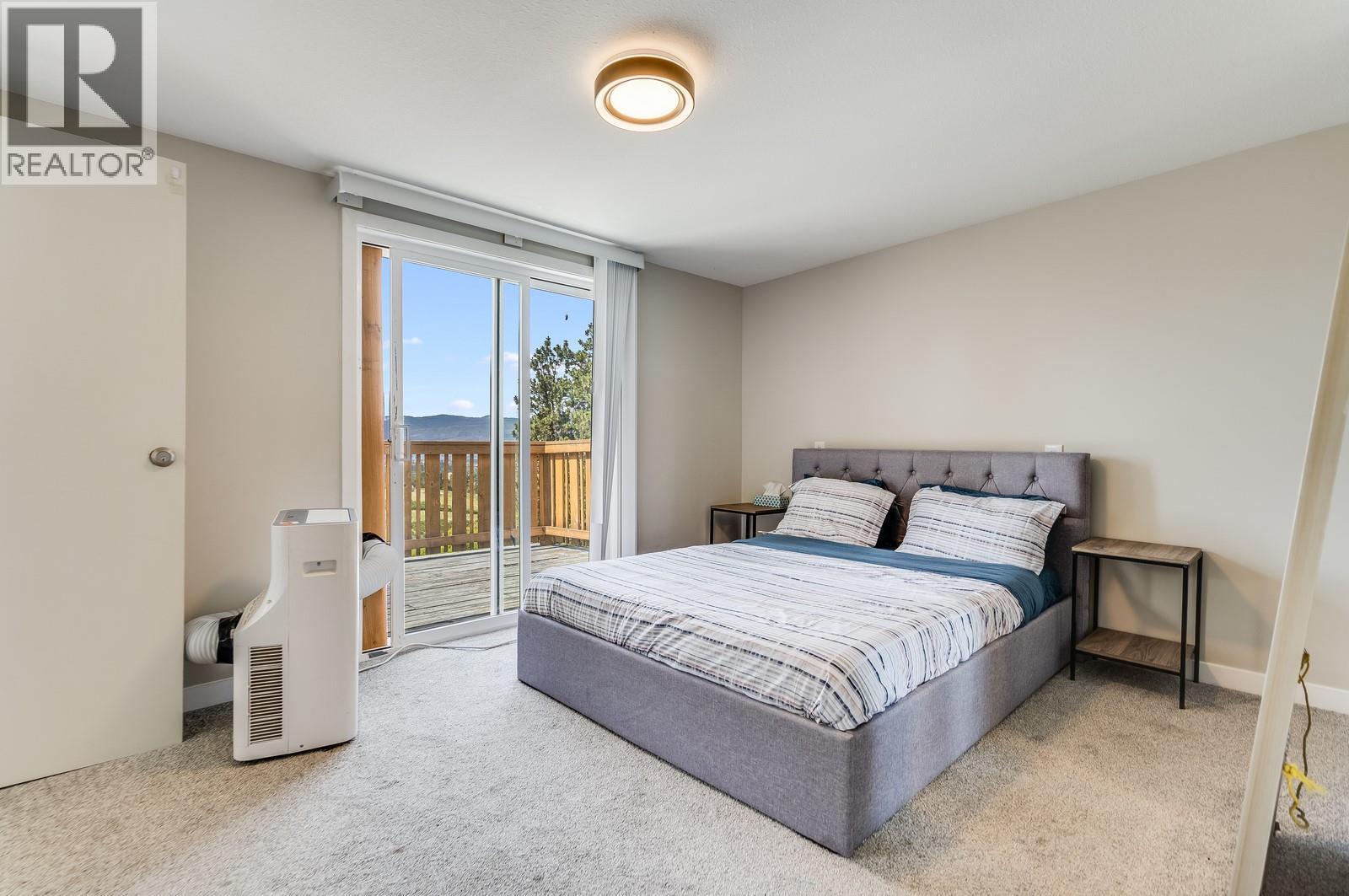 1293 Highway 33 E, Kelowna, BC - Indoor Photo Showing Bedroom