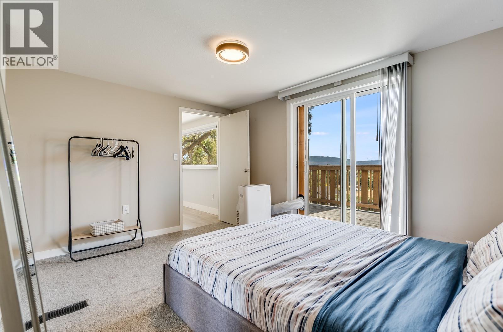 1293 Highway 33 E, Kelowna, BC - Indoor Photo Showing Bedroom