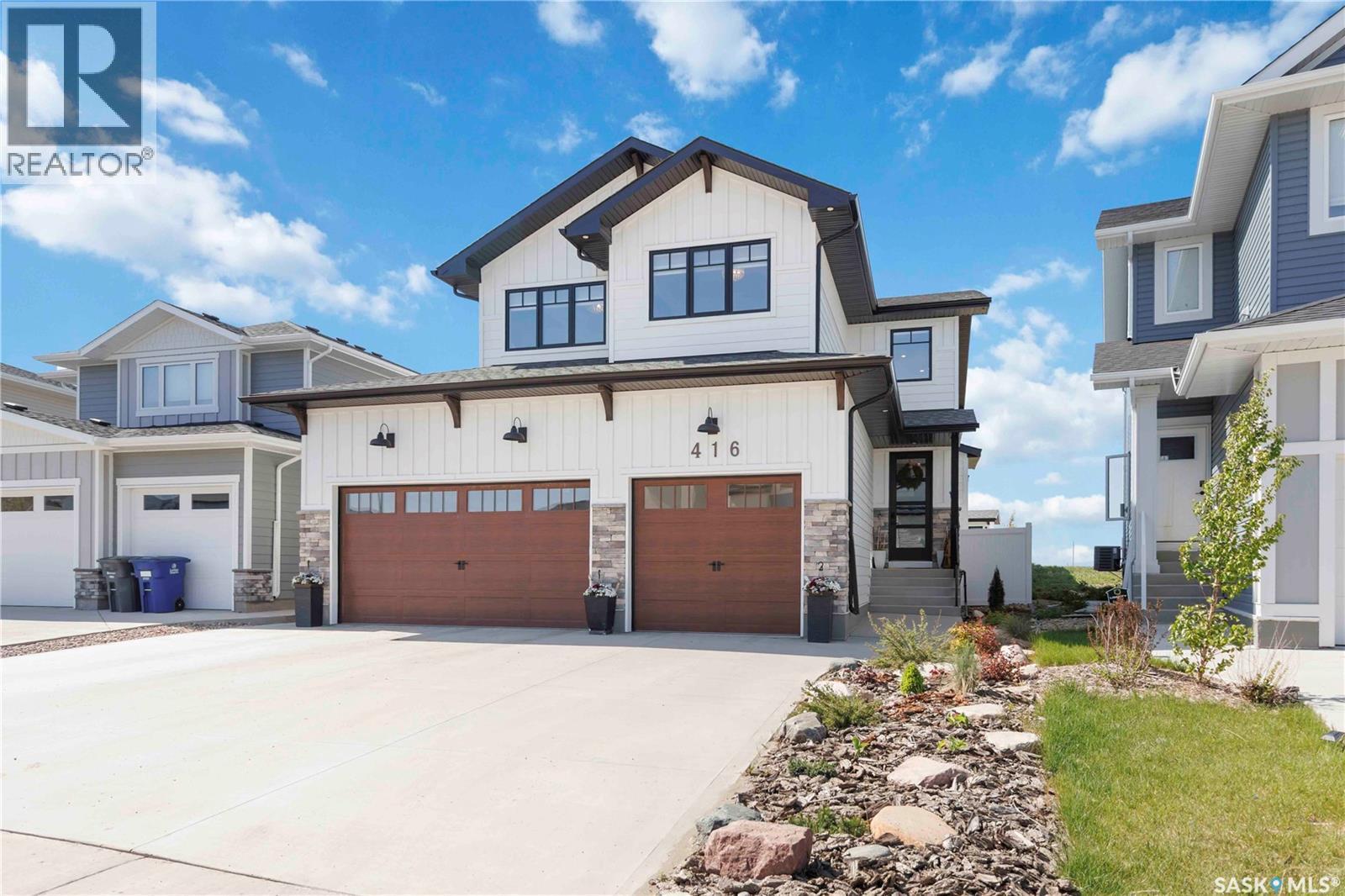 416 Woolf Bend, Saskatoon, SK - Outdoor With Facade