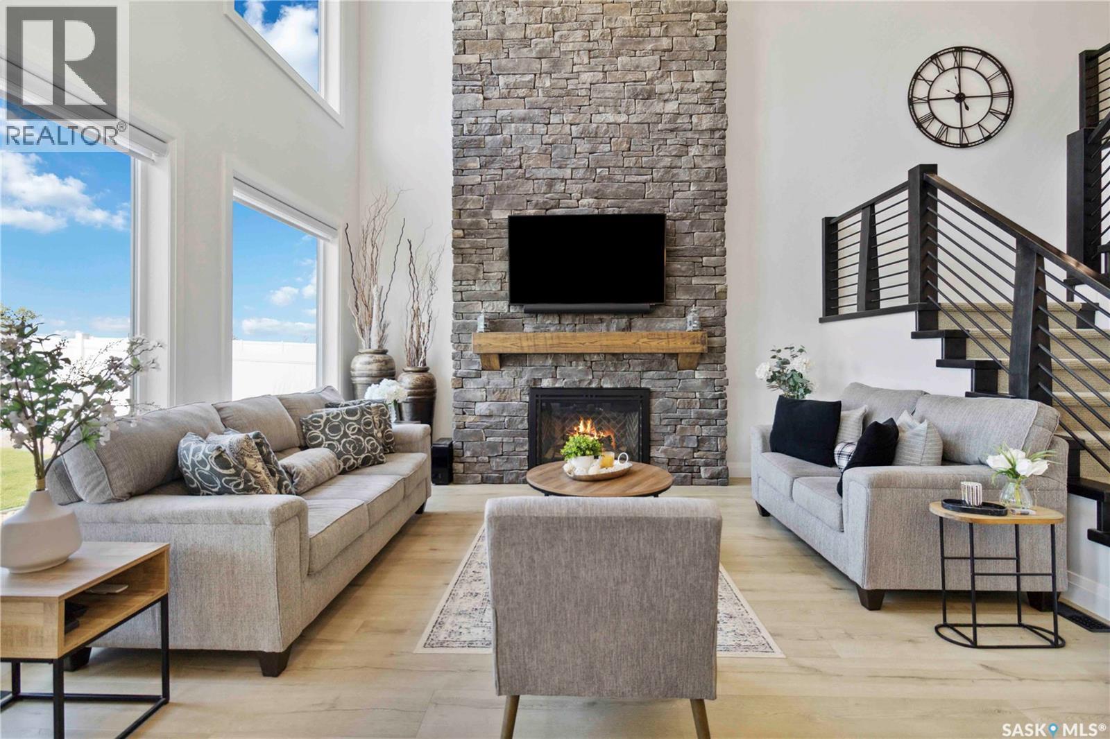 416 Woolf Bend, Saskatoon, SK - Indoor Photo Showing Living Room With Fireplace