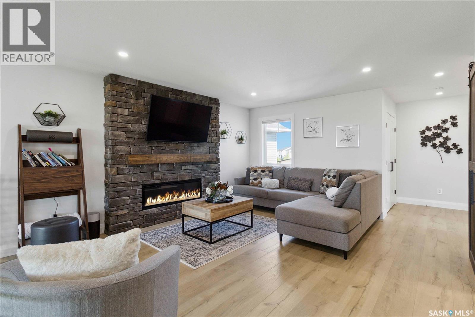 416 Woolf Bend, Saskatoon, SK - Indoor Photo Showing Living Room With Fireplace