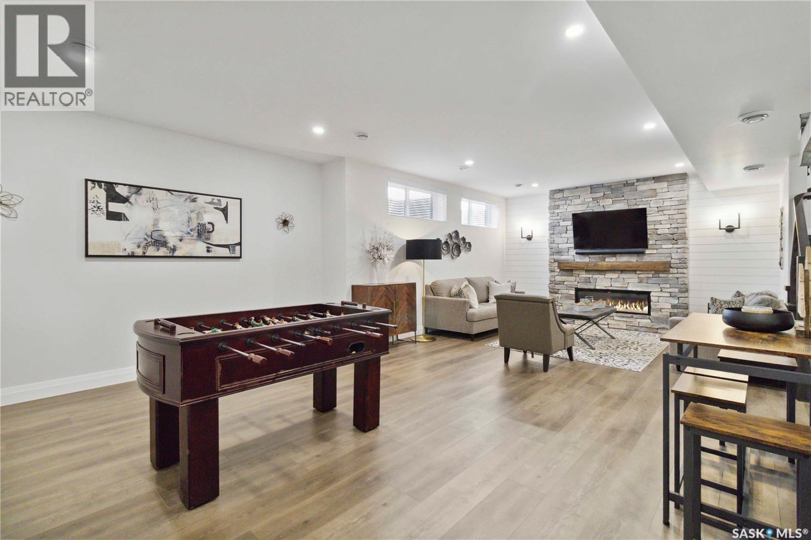 416 Woolf Bend, Saskatoon, SK - Indoor Photo Showing Other Room With Fireplace