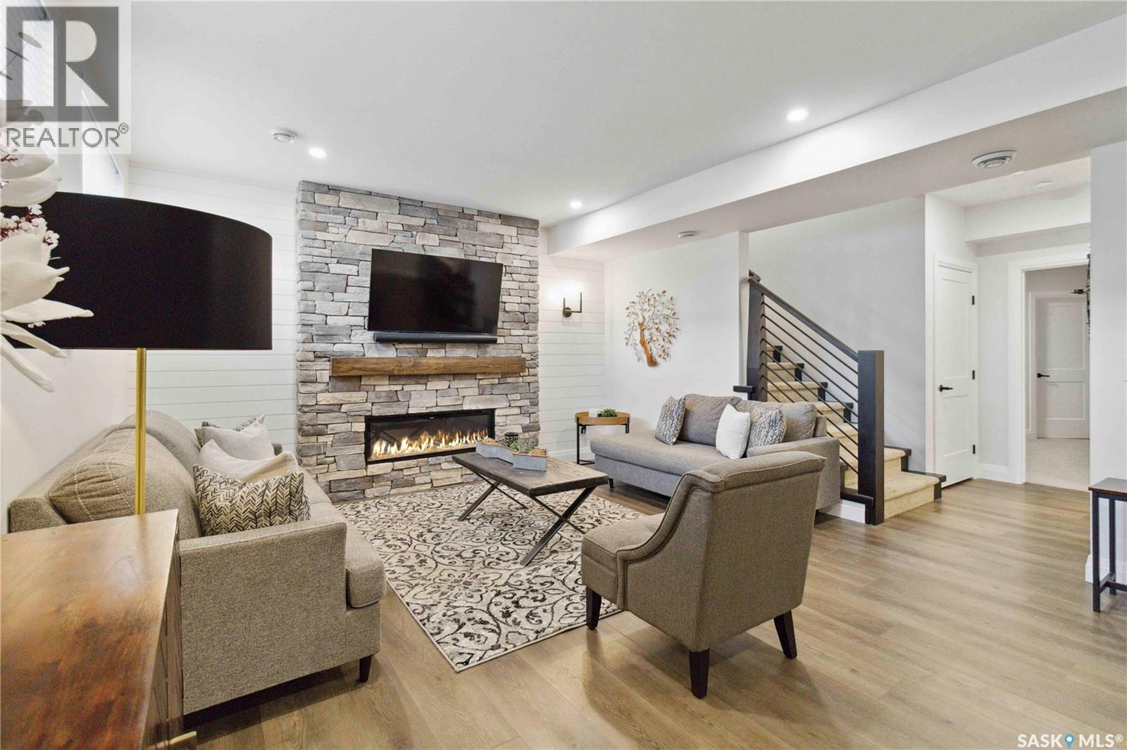 416 Woolf Bend, Saskatoon, SK - Indoor Photo Showing Living Room With Fireplace