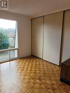 Primary bedroom with large window. -