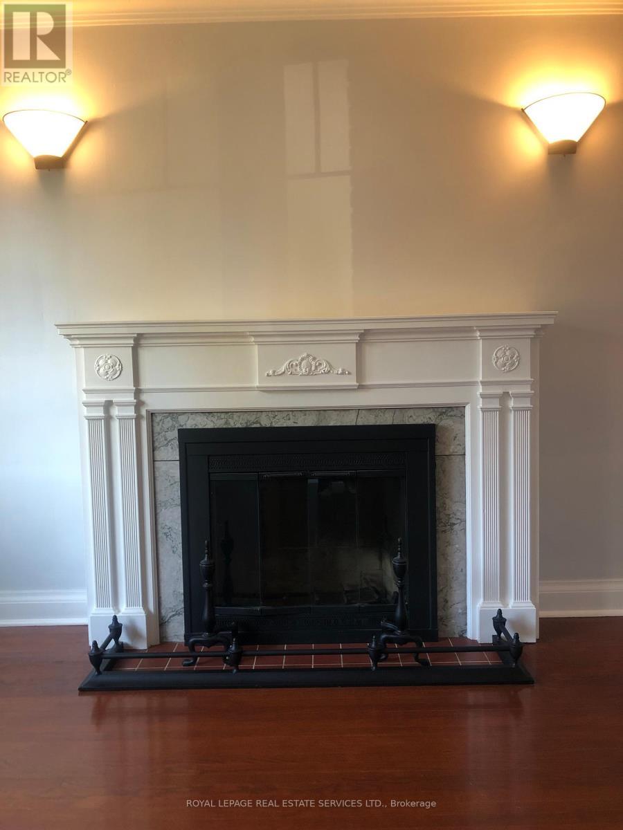 Main Fl - 1 Ash Crescent, Toronto, ON - Indoor Photo Showing Living Room With Fireplace