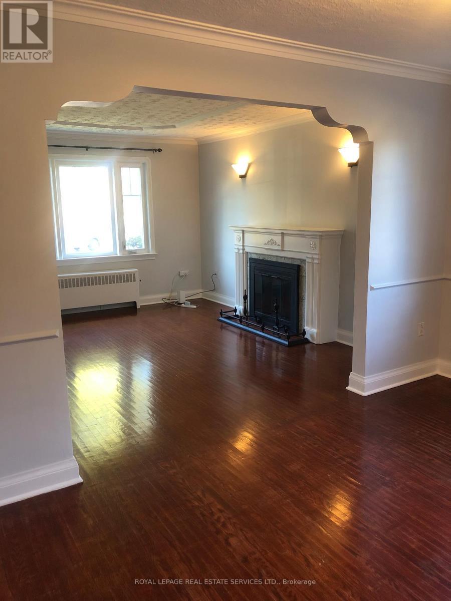 Main Fl - 1 Ash Crescent, Toronto, ON - Indoor Photo Showing Other Room With Fireplace