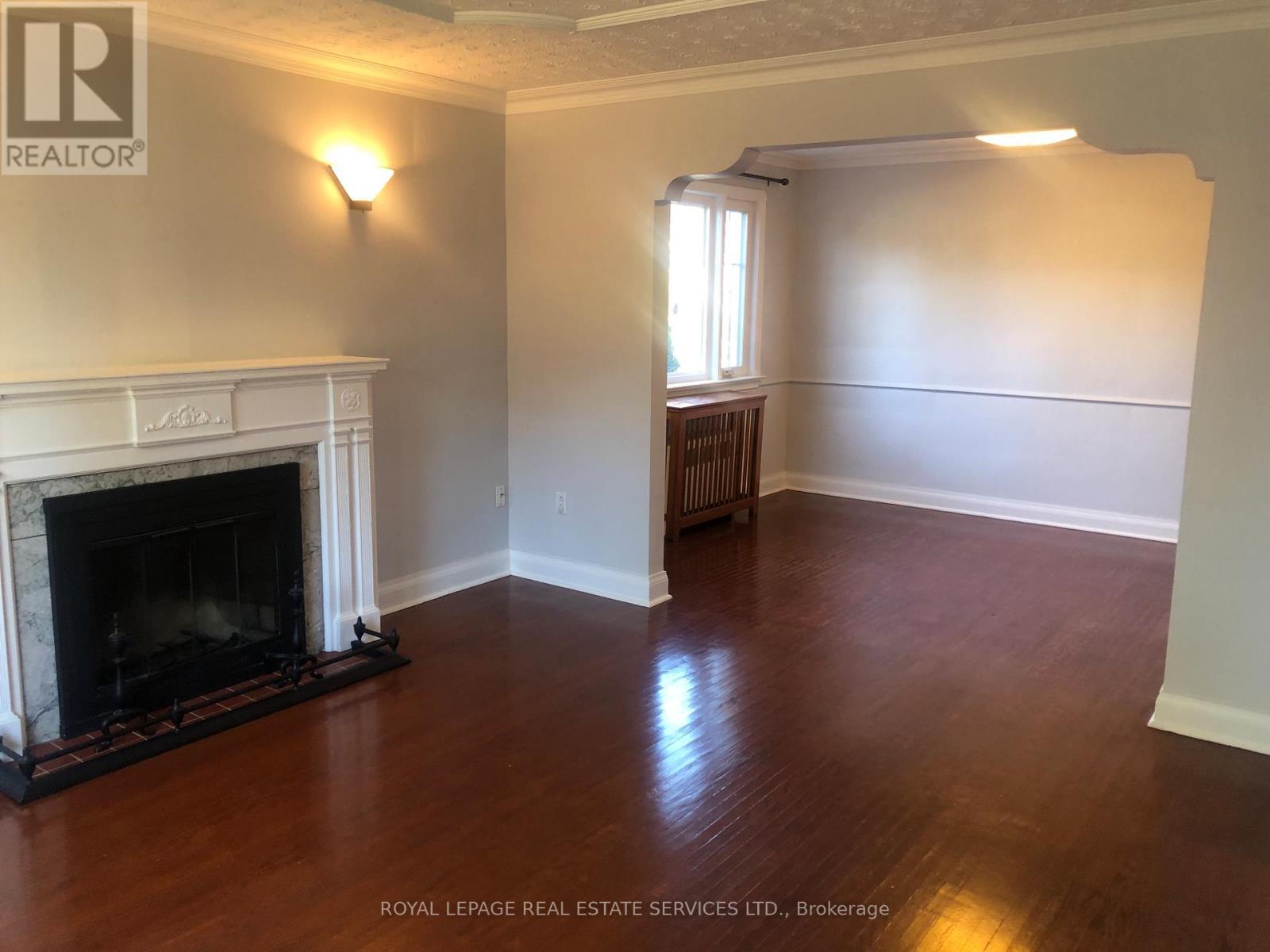 Main Fl - 1 Ash Crescent, Toronto, ON - Indoor Photo Showing Living Room With Fireplace