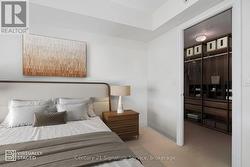VIRTUALLY STAGED - Bedroom showing walk in closet -