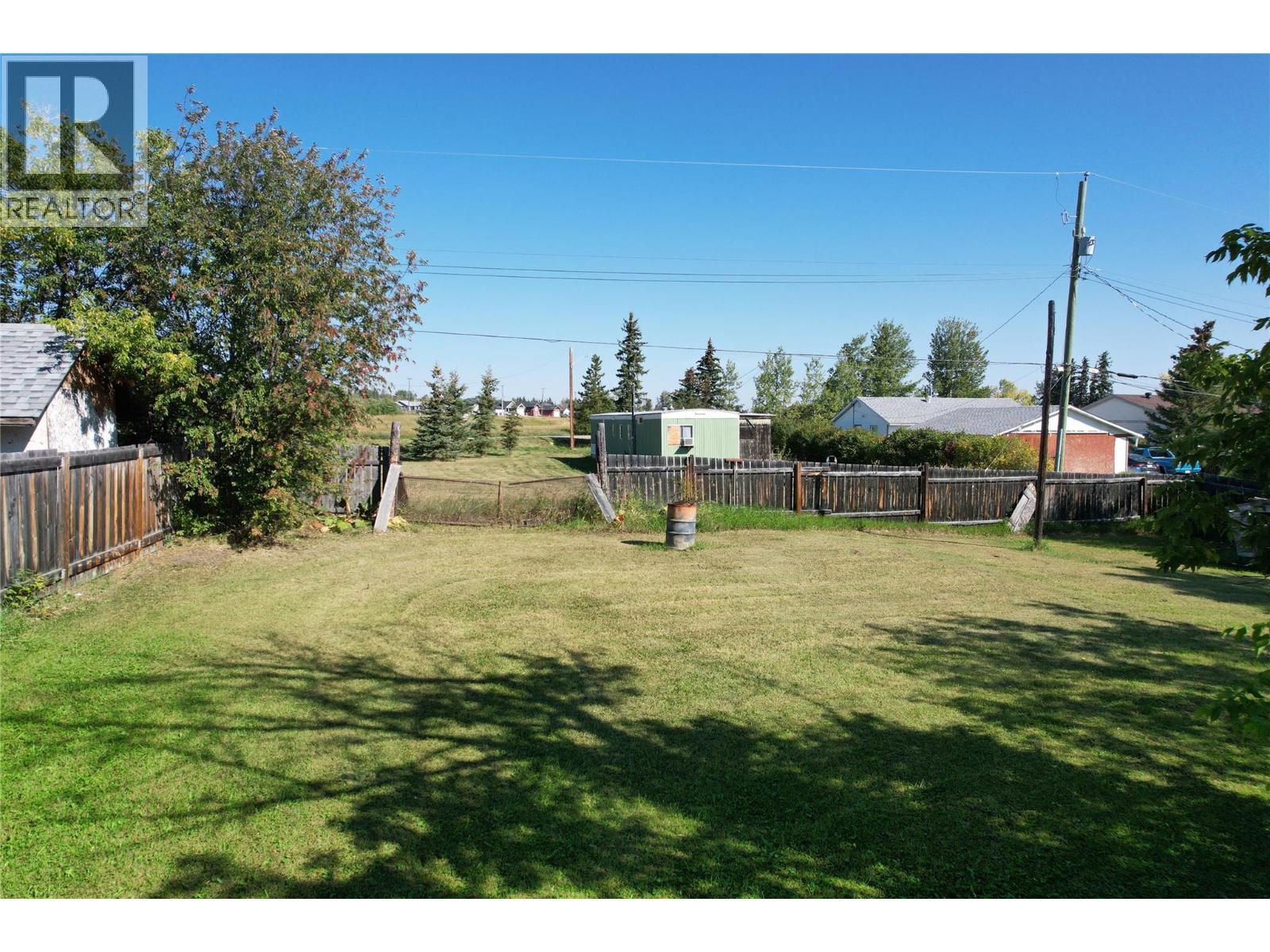 4810 48 Avenue, Pouce Coupe, BC - Outdoor With Backyard