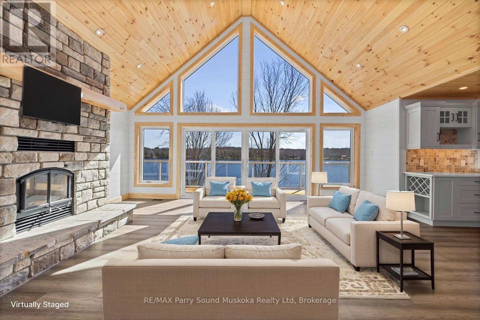 Living room, Virtually staged - 49 Hardies Road, Mckellar, ON - Indoor Photo Showing Living Room With Fireplace