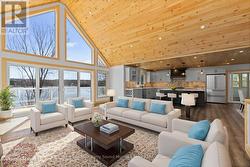 Wall of windows to enjoy lake views (v. staged) -