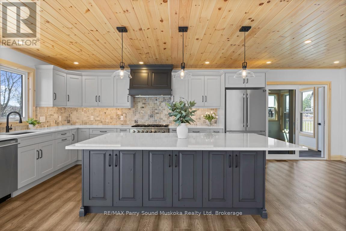 Quartz counters - 49 Hardies Road, Mckellar, ON - Indoor Photo Showing Kitchen With Upgraded Kitchen