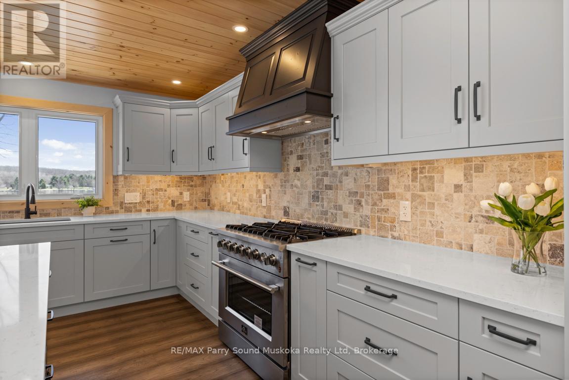 Under cabinet lighting - 49 Hardies Road, Mckellar, ON - Indoor Photo Showing Kitchen With Upgraded Kitchen