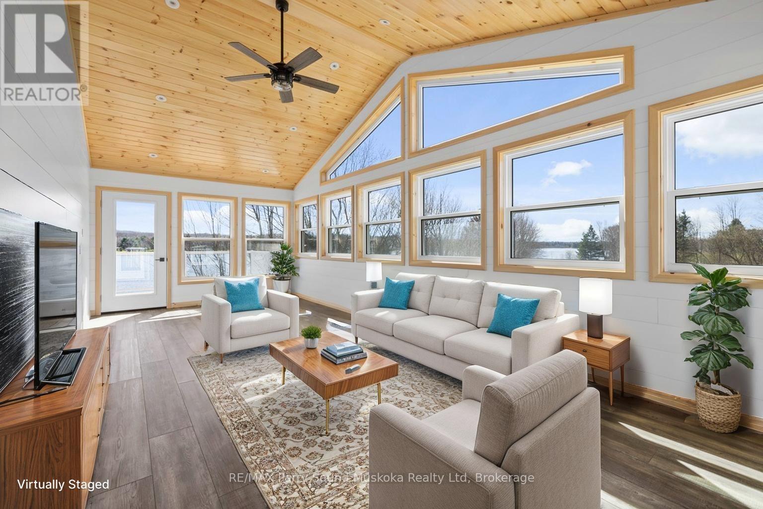 Sunroom, Virtually staged - 49 Hardies Road, Mckellar, ON - Indoor Photo Showing Living Room