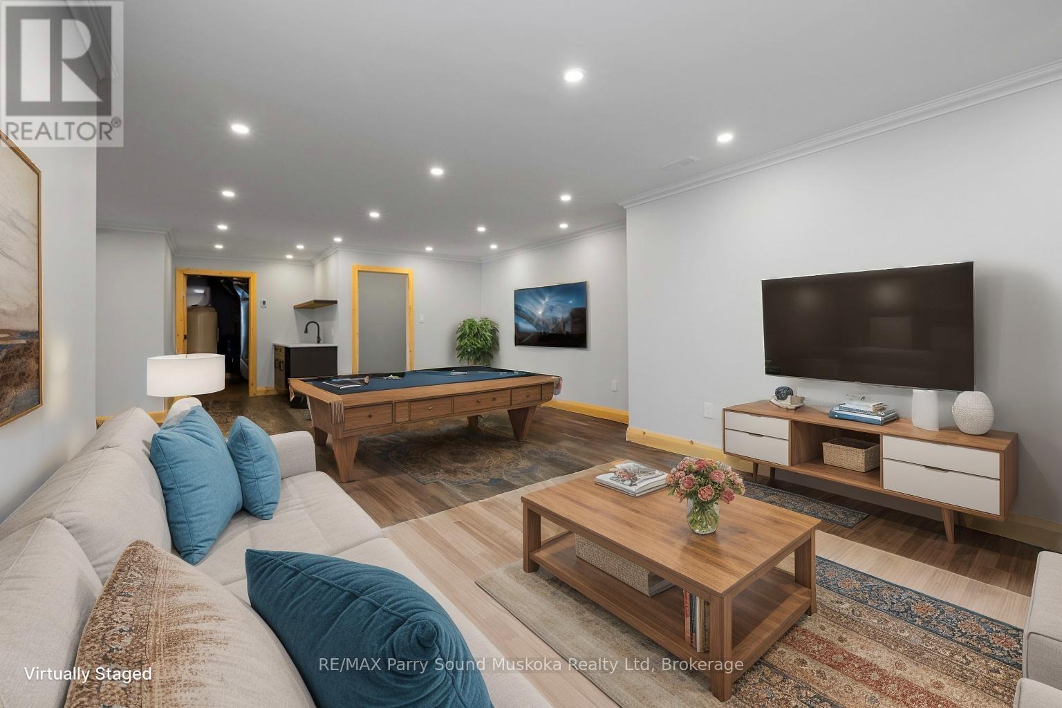 Lower level rec room, virtually staged - 49 Hardies Road, Mckellar, ON - Indoor Photo Showing Living Room