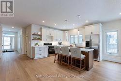 Kitchen with Large Quartz top Counter and Island -