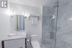 Bathroom with Glass Shower and Granite -