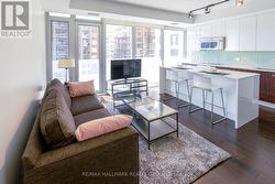 Living Room and Kitchen with Hardwood Floors -