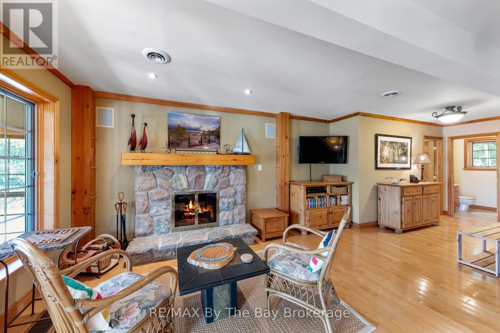 19980 Georgian Bay Shore, Georgian Bay (Gibson), ON - Indoor Photo Showing Living Room With Fireplace