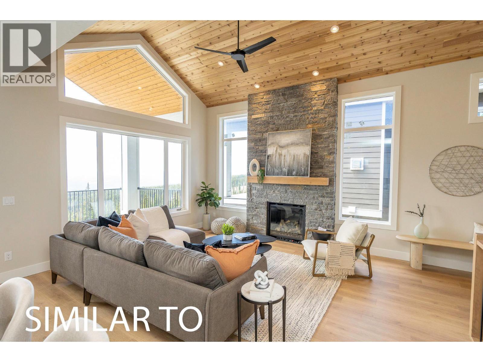 225A Grizzly Ridge Trail, Big White, BC - Indoor Photo Showing Living Room With Fireplace