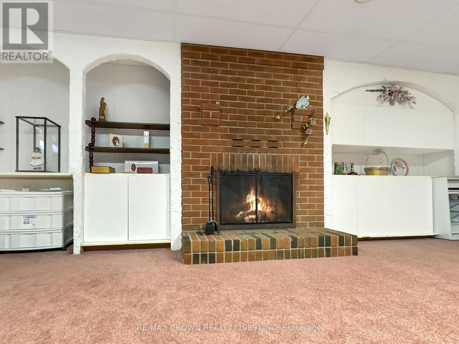 1501 West Street, Hearst, ON - Indoor Photo Showing Living Room With Fireplace