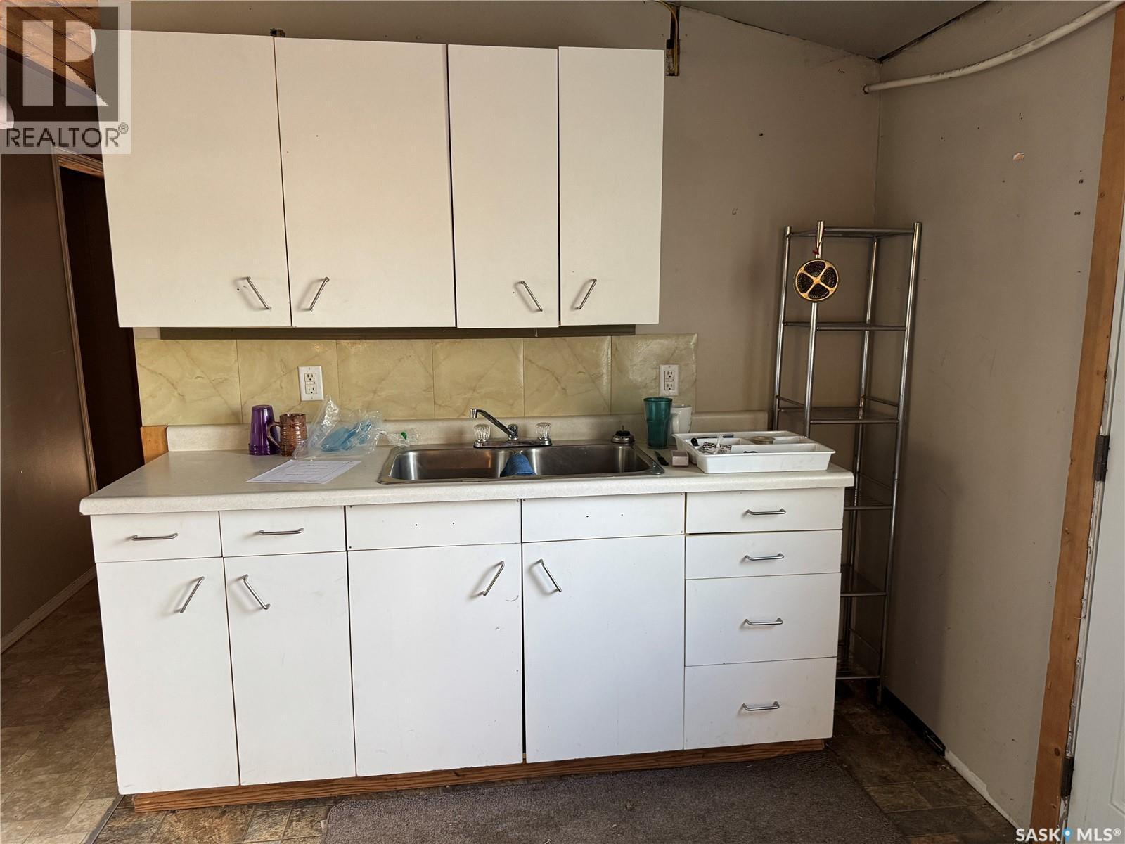 87 Wadin Drive, Northern Admin District, SK - Indoor Photo Showing Kitchen With Double Sink
