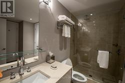 Bathroom with Granite and Glass Shower -