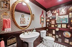 Bathroom with ornamental molding and toilet -