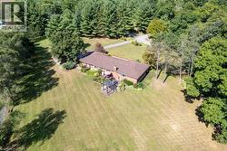 View of subject property featuring a heavily wooded area -