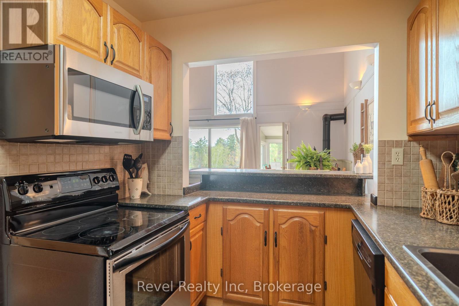 view from kitchen to lving area - 14 Swallow Road, Mcdougall, ON - Indoor Photo Showing Kitchen