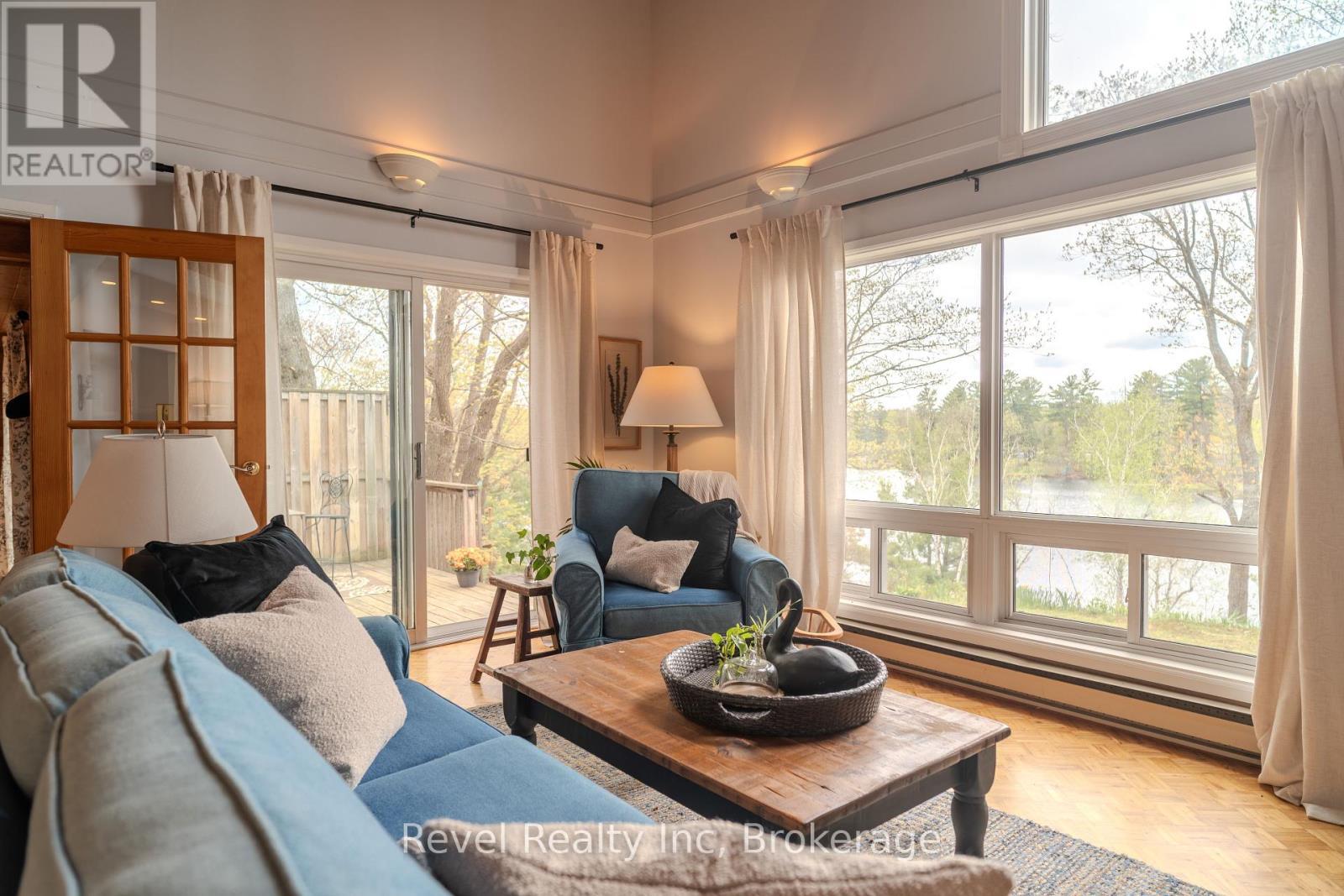 Living room view and walk-out - 14 Swallow Road, Mcdougall, ON - Indoor Photo Showing Living Room