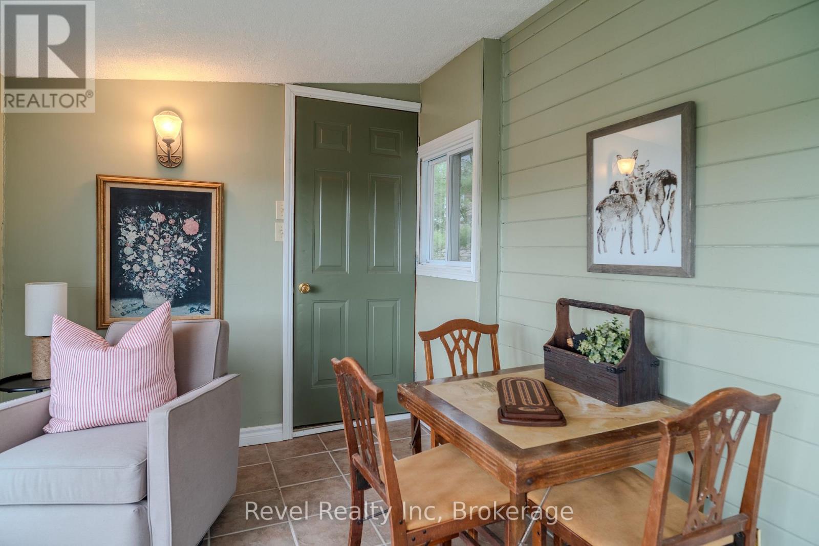Sunroom walkout to side deck - 14 Swallow Road, Mcdougall, ON - Photo Showing Dining Room