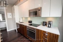 Kitchen with Hardwood & Floor-to-Ceiling Windows -