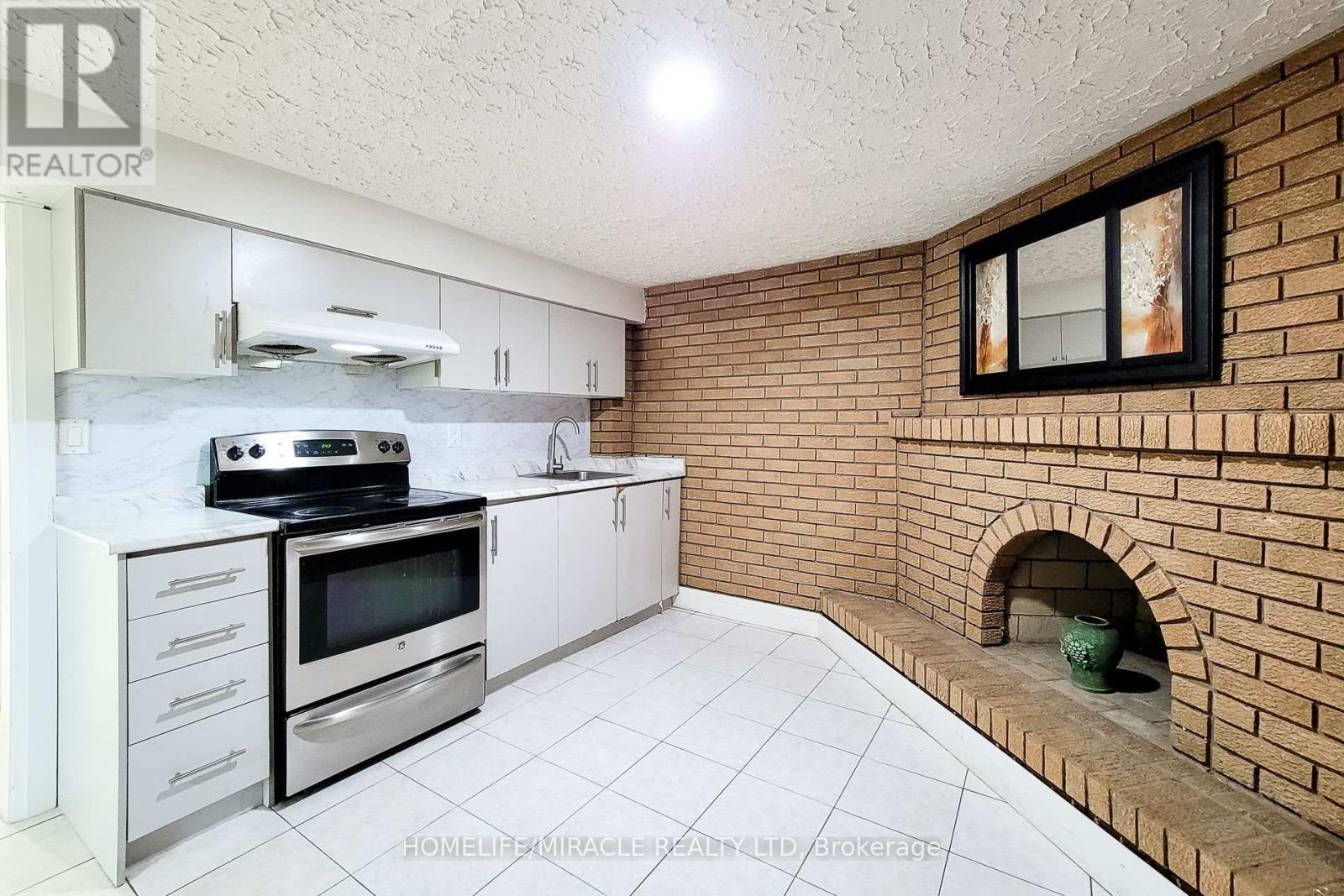 12 Maitland Avenue, Hamilton, ON - Indoor Photo Showing Kitchen With Fireplace