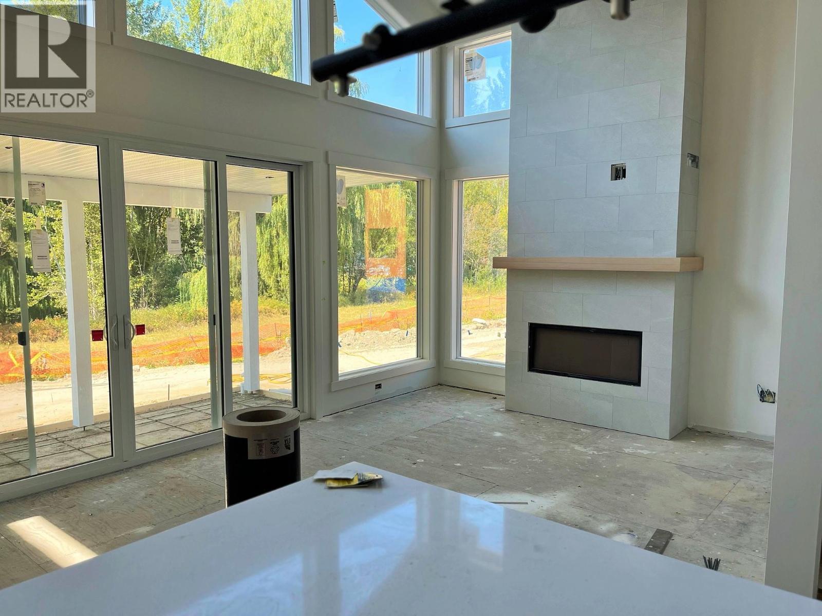 Photo for likeness reference (Unit 3) Some Upgraded Features Included - 8200 97A Highway Unit# 8, Mara, BC - Indoor With Fireplace