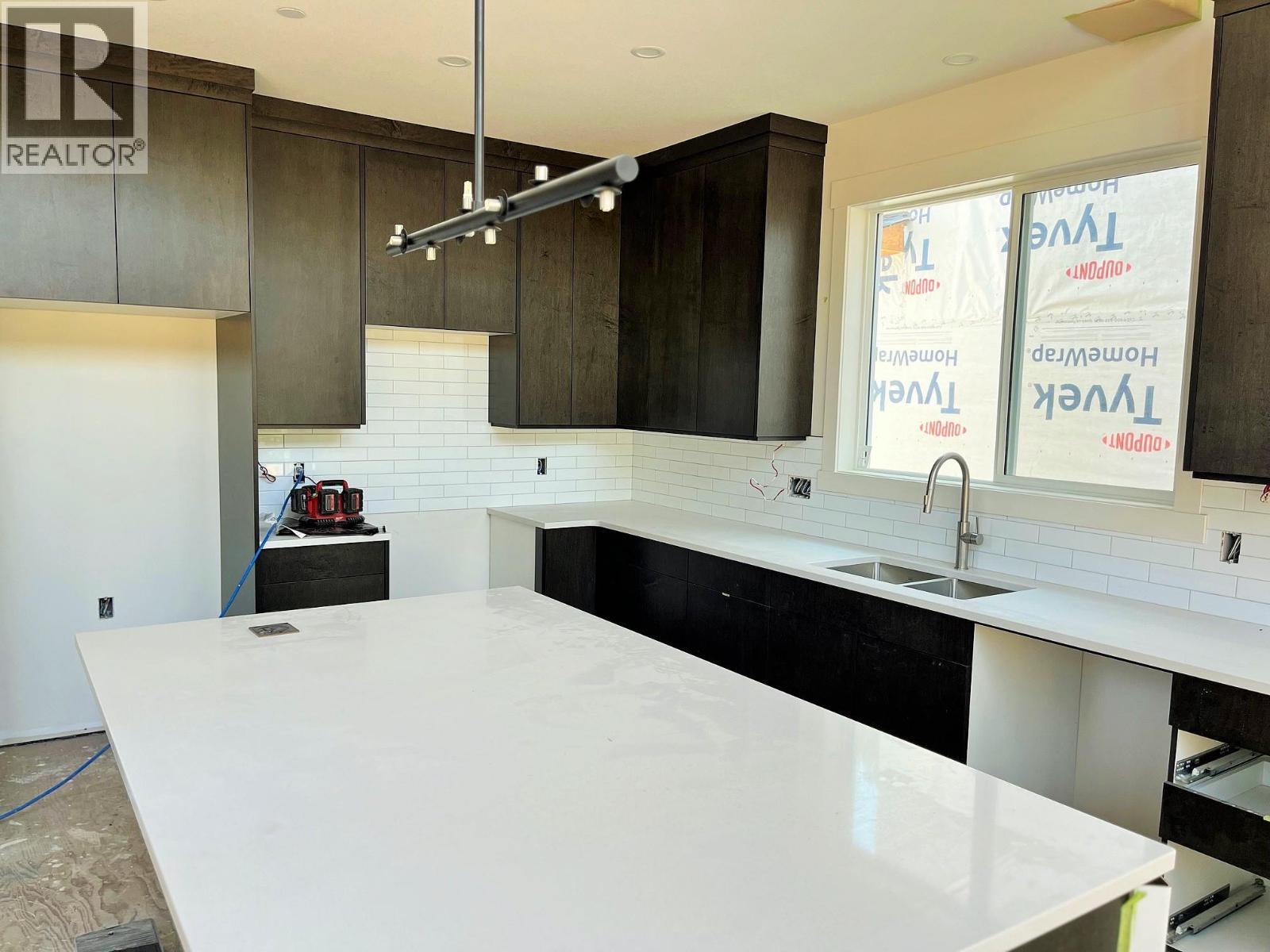 Photo for likeness reference (Unit 3) Some Upgraded Features Included - 8200 97A Highway Unit# 8, Mara, BC - Indoor Photo Showing Kitchen With Double Sink